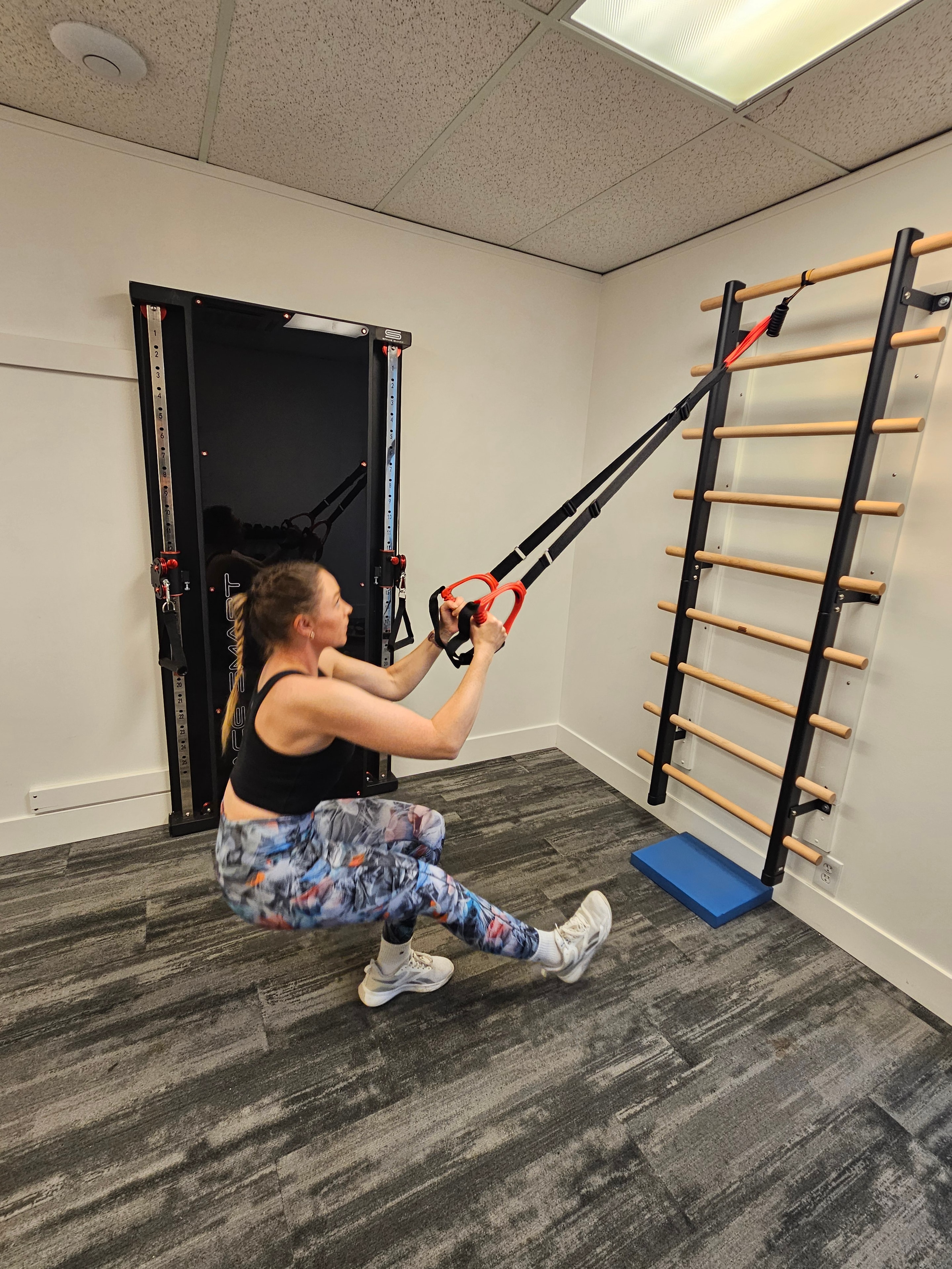 Client completing suspension training in the studio